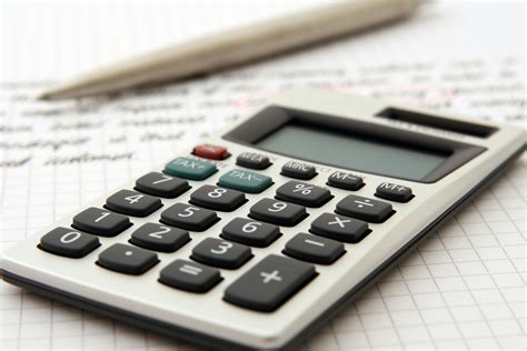 White and Black Desk Calculator on White Graphing Paper · Free Stock Photo