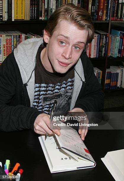 Macaulay Culkin Signs His Book Junior Photos and Premium High Res ...