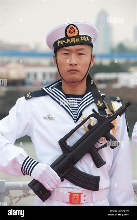 A member of the Chinese Navy stands in an honor cordon for Secretary of ...