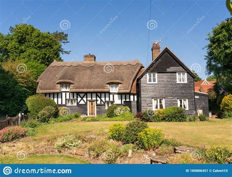 British English Country Cottage with Thatched Roof and Cottage Garden ...