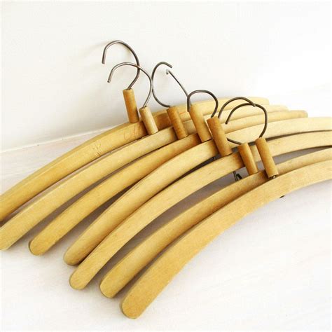 Wood hangers looking great with vintage clothing! Click the picture! #merilinsretro | Wood coat ...