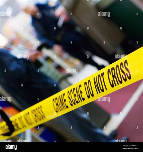 Caution tape at a crime scene Stock Photo - Alamy