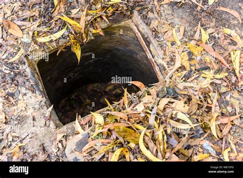 Entrance hole to the Chi Chu tunnels, Vietnam Stock Photo - Alamy