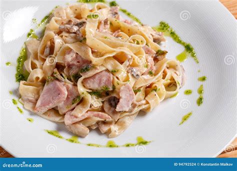 Tagliatelle Pasta with Ham, Mushrooms and Yolk. Selective Focus Stock ...