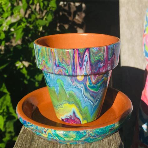 Reenie Shannon OLeary on Instagram: “Acrylic paint pour on terra-cotta pot. Available for ...