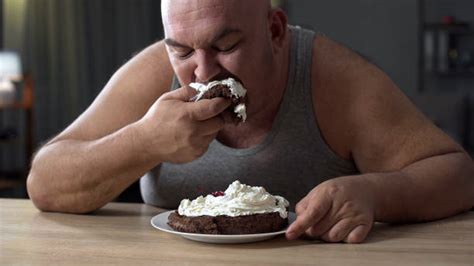 460+ Fat Guy Eating Cake Pictures Stock Photos, Pictures & Royalty-Free ...