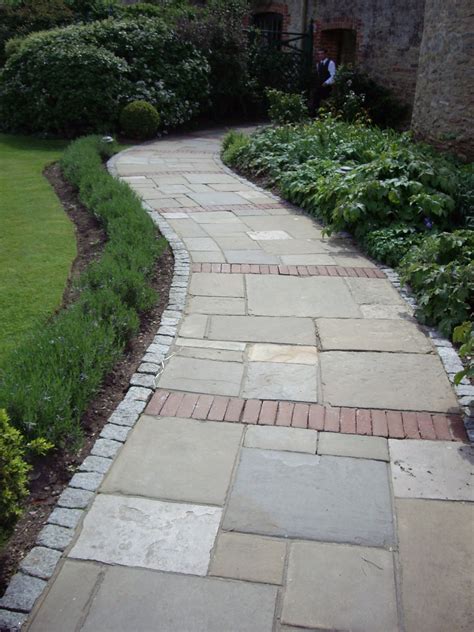 Random rectangular paved path with sett edging and brick detail, Le ...