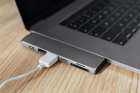 Laptop with type c adapter with plugged USB cable · Free Stock Photo