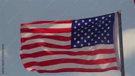 American Flag Waving Slow Motion. Large American Flag flies. US flag ...