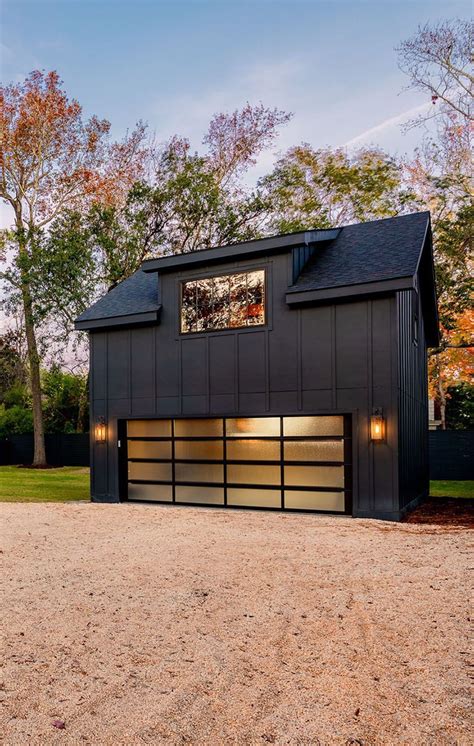 Ultra modern all black detached garage with double wide door and living ...