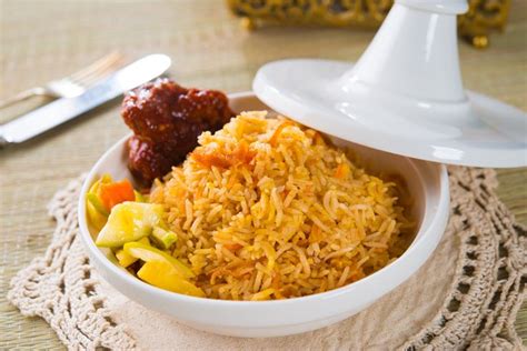 Shan-style Rice is a must-try Burmese dish. It combines rice that's been cooked with turmeric ...