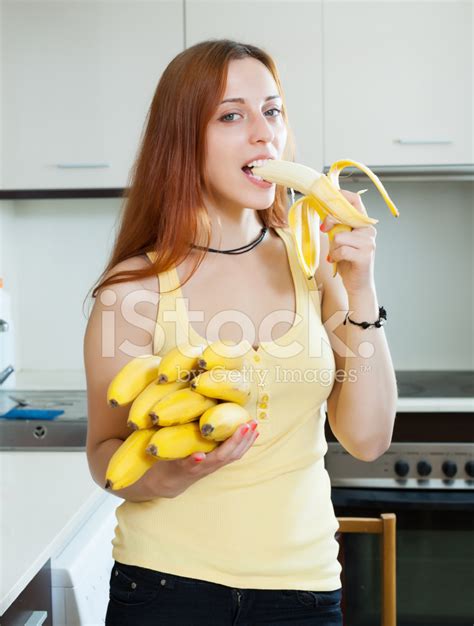 Long-Haired Woman Eating Banana Stock Photo | Royalty-Free | FreeImages