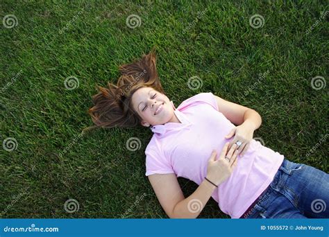 Laying in the grass stock photo. Image of laying, park - 1055572