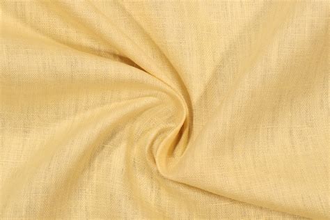 Onyx Age Linen Solid Drapery Fabric in Butter