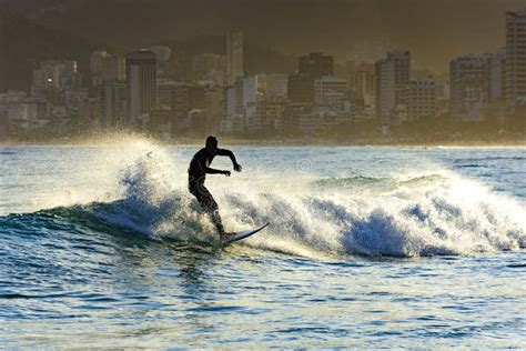 Surfing on Ipanema beach editorial photo. Image of arpoador - 97127376