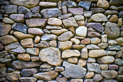 River stone wall 27087799 Stock Photo at Vecteezy