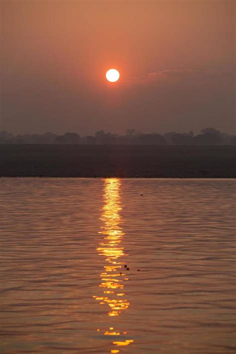 Sunrise on the Ganga river, Varanasi, India 9565211 Stock Photo at Vecteezy