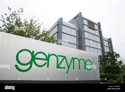 A logo sign outside of a facility occupied by the Genzyme Corporation ...