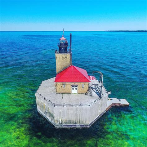 Built in 1878, the striking six-story Port Austin Reef Light sits in a shallow area of Saginaw ...