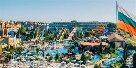 Panoramic View of Water Park Action in Sunny Beach with Number of Slides and Swimming Pools for ...