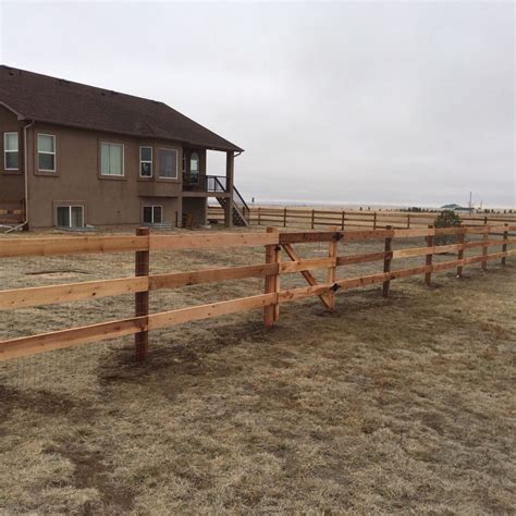 3-rail cedar fence using 4x4 cedar posts and 2x6 cedar rails with ...