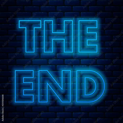 Glowing neon line The End handwritten inscription icon isolated on brick wall background ...