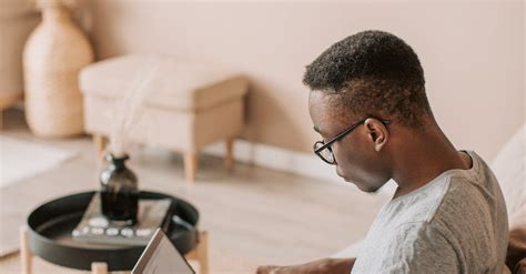 Photo of a Man Sitting on Sofa While Using Laptop · Free Stock Photo