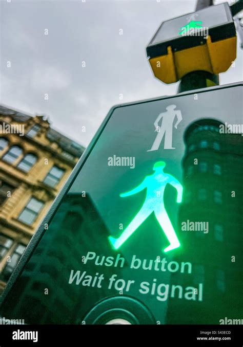 Puffin pedestrian crossing with green man light Stock Photo - Alamy