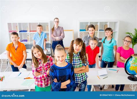 Happy Students in Classroom Stock Image - Image of school, young: 89647453