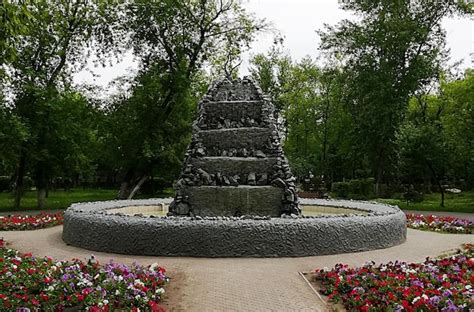 Premium Photo | Recreation park green square in the city center fountain