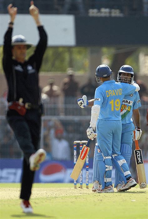 Billy Bowden signals a six hit by Mahendra Singh Dhoni. The Indian innings featured ten sixes in ...