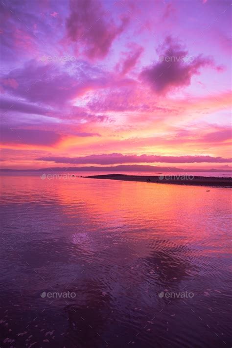 Pink purple sky during sunset over water background vertical Stock ...