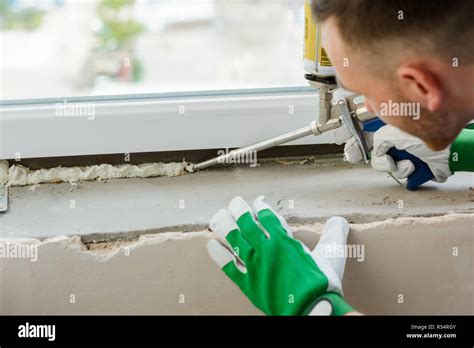 Applying polyurethane foam Stock Photo - Alamy