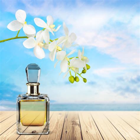 Premium Photo | Perfume bottle and flowers on background