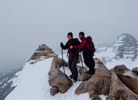 two men hiking up a massive stoney mountain in the | Stable Diffusion ...