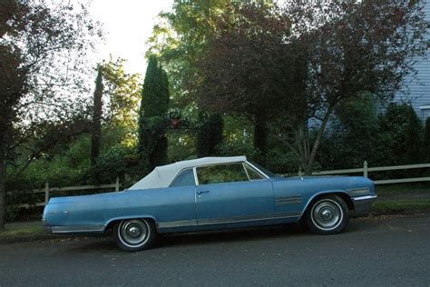 OLD PARKED CARS.: 1964 Buick Wildcat Convertible.