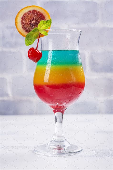 Summer rainbow layered cocktail containing summer, rainbow, and color ...