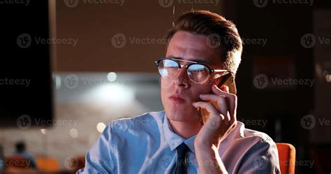 man using mobile phone in dark office 11254210 Stock Photo at Vecteezy