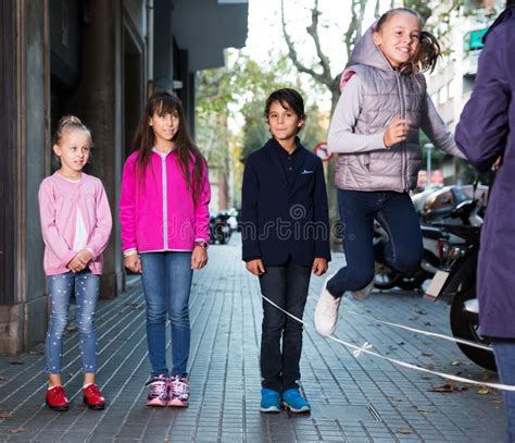 Children play on street stock image. Image of little - 226694419