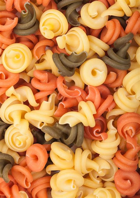 Premium Photo | Raw homemade tricolore trottole pasta macro top view