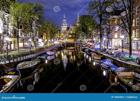 Amsterdam s canal at night stock image. Image of culture - 70864861