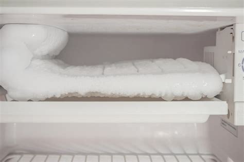 Premium Photo | Frozen ice buildup in the freezer of refrigerator