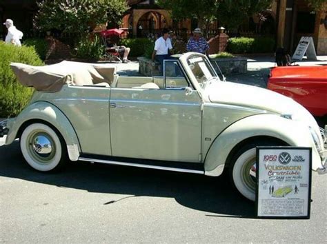 an old car is parked on the street