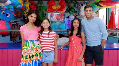 Rishi Sunak strolls along sun-soaked California pier with his family in holiday photos ...