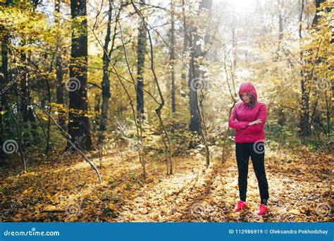 Woman Running on a Forest Road during Sunrise Stock Image - Image of ...