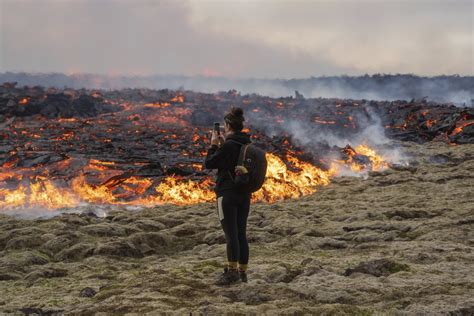 Iceland warns tourists to stay away from volcano erupting with lava and ...