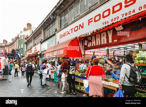 Electric Avenue Brixton, ethnic food shops, market stalls, supermarkets, people shopping in ...