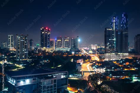 Johor Bahru, Malaysia, at night. Malaysian city with traffic on highway ...