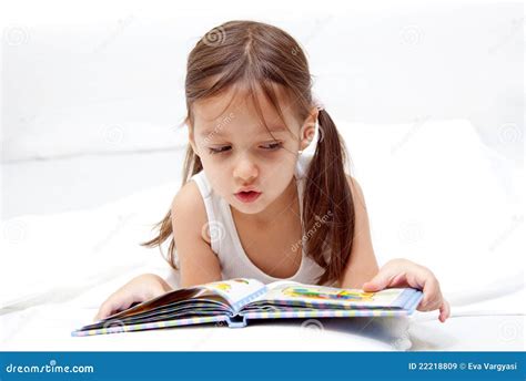 Sweet Little Girl Reading A Book Royalty Free Stock Images - Image: 22218809