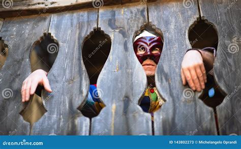 The Mask of Arlecchino. Look between the Wooden Terrace Stock Image - Image of wooden, mask ...